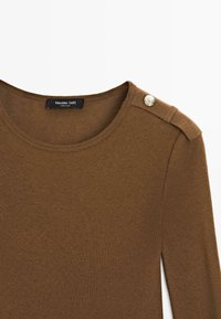 Brown ribbed sweater featuring a rounded neckline, shoulder buttons, and a soft texture. Label reads "Massimo Dutti" with "Made in China."
