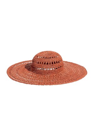 Wide-brimmed, rust-colored crochet sun hat with circular patterns and small open knit details around the crown.