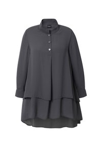 Dark gray long-sleeve blouse with layered hem, high collar, and three front buttons, made of lightweight fabric.