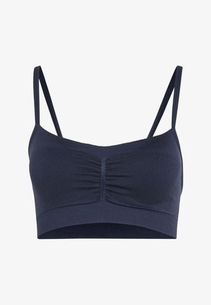 Dark blue seamless bralette with thin adjustable straps and ruched center front detail on a white background.