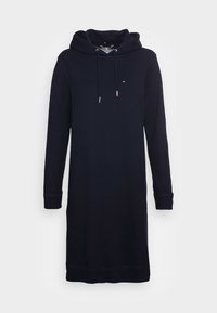 Mörkblå luvtröja klänning i mjukt material, med långa ärmar, en framficka i kängurustil och dragsnören vid huvan.