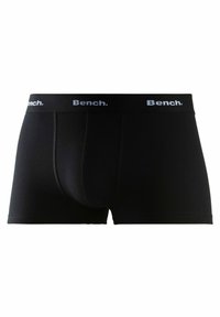 Black boxer briefs made of smooth fabric, featuring a solid design and a contrasting white "Bench." logo on the elastic waistband.