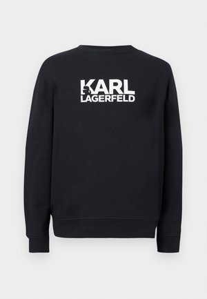 Čierna mikina s dlhým rukávom s bielym nápisom "KARL LAGERFELD" a malým profilovým siluetom začleneným do písmena "K" na prednej strane.
