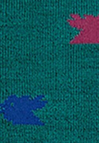 Tessuto lavorato a maglia in teal con forme astratte blu e rosa. La trama è leggermente ruvida, mostrando un motivo colorato e giocoso.