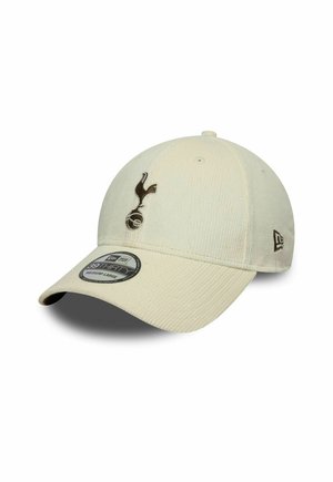 Casquette de baseball en velours côtelé beige clair avec un logo brodé noir de Tottenham Hotspur à l'avant et un logo de la marque New Era sur le côté.