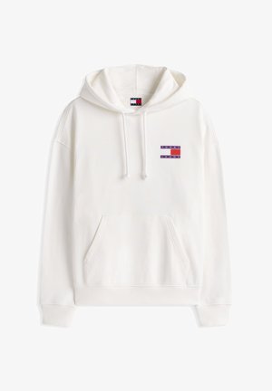 White hooded sweatshirt featuring a front pocket, ribbed cuffs, and a small red and purple "TOMMY JEANS" logo on the chest.