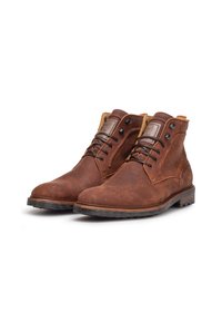 Bottes ankle en cuir marron avec une finition texturée, bout rond, devant à lacets noirs et col contrastant tan. Semelle en caoutchouc pour l'adhérence.