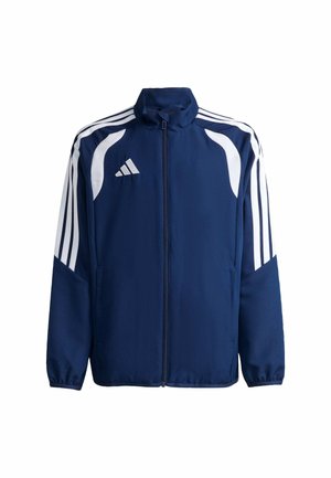 Marineblaue Sportjacke mit weißen Streifen an den Ärmeln, weißem Logo auf der Brust und Reißverschluss vorne, auf weißem Hintergrund dargestellt.