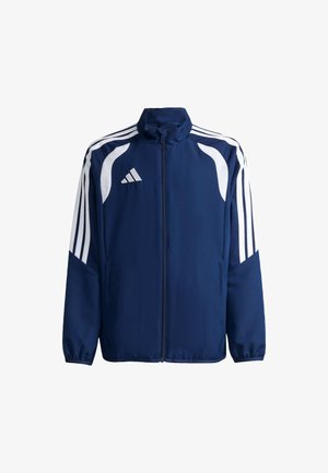 Marineblaue Sportjacke mit weißen Streifen an den Ärmeln, weißem Logo auf der Brust und Reißverschluss vorne, auf weißem Hintergrund dargestellt.