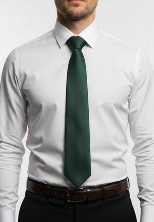 White long-sleeve shirt with a crisp collar, paired with a dark green tie featuring a textured finish, and a brown leather belt.
