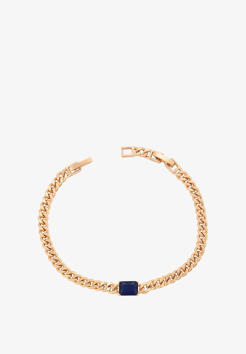 Náramek s řetízkem ve zlatém odstínu s obdélníkovým modrým kamenem uprostřed, který má hladký kovový povrch a propojené články.
