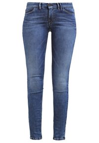 Smala jeans i mörkblå denim med lätt blekning. Funktioner inkluderar bältesöglor, framknapp, dragkedja och traditionell femficksdesign.