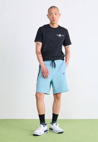 Nike Sportswear SPORTSWEAR TECH FLEECE - Calças de fato de treino - denim turq/black