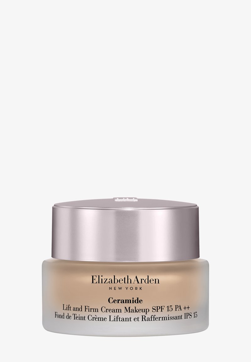 Elizabeth Arden Ceramide Lift and Firm creme makeup med SPF 15, beige tone og metalisk lyserødt låg på hvid baggrund.