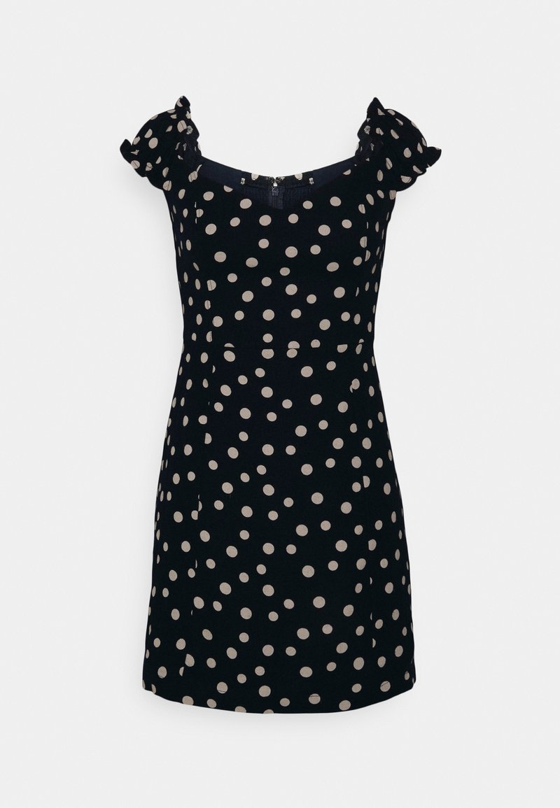 Schwarzes Kleid mit weißen Punkten, kurzen Puffärmeln, rundem Ausschnitt und figurbetonter Silhouette. Besitzt einen Reißverschluss auf der Rückseite.