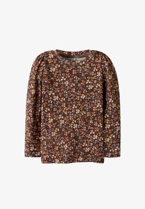 Langarmshirt vanbruin stof met een bloemenpatroon van roze, gele en crèmekleurige bloemen. Ronde halslijn en pofschouders.