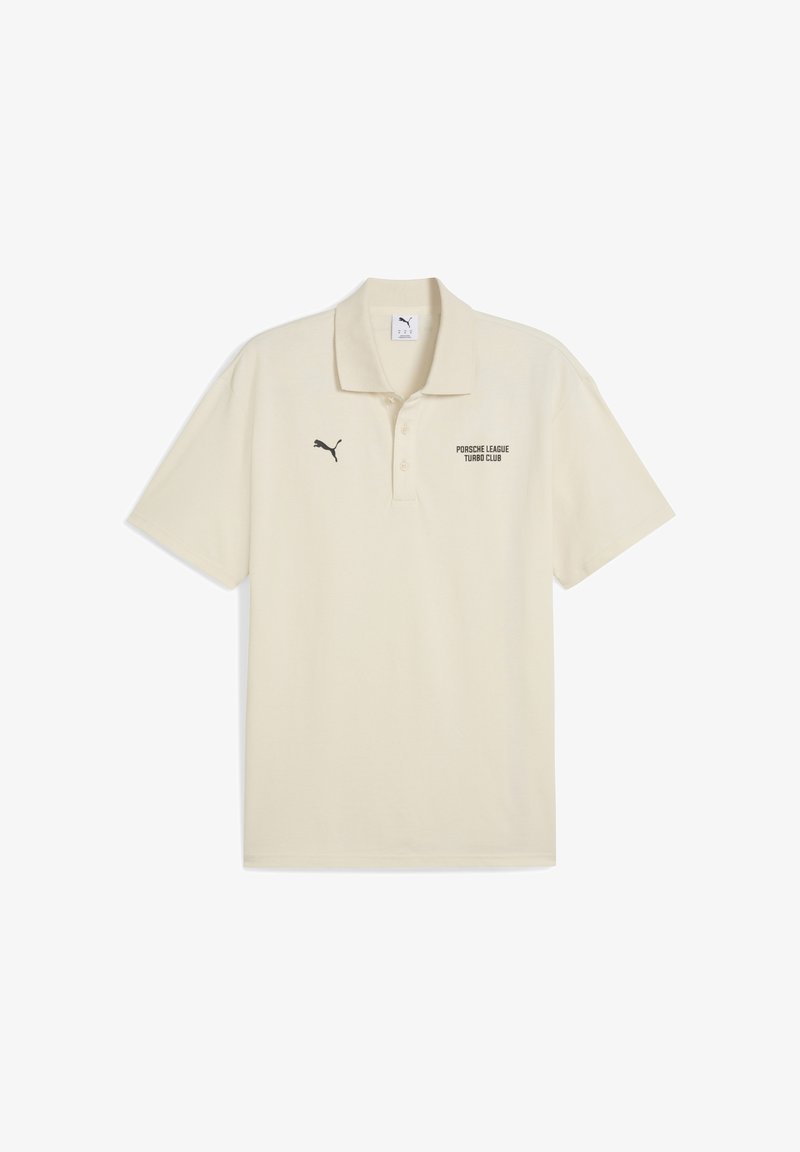 Kreemivärvi polo särk, millel on must "Porsche League Turbo Club" tekst ja väike must Puma logo vasakul rinnal.