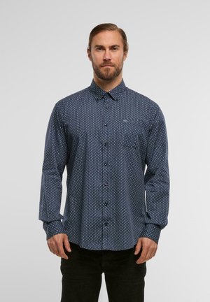 Navy blue button-up shirt with a geometric pattern, long sleeves, and a classic collar. Fabric appears lightweight with a smooth texture.