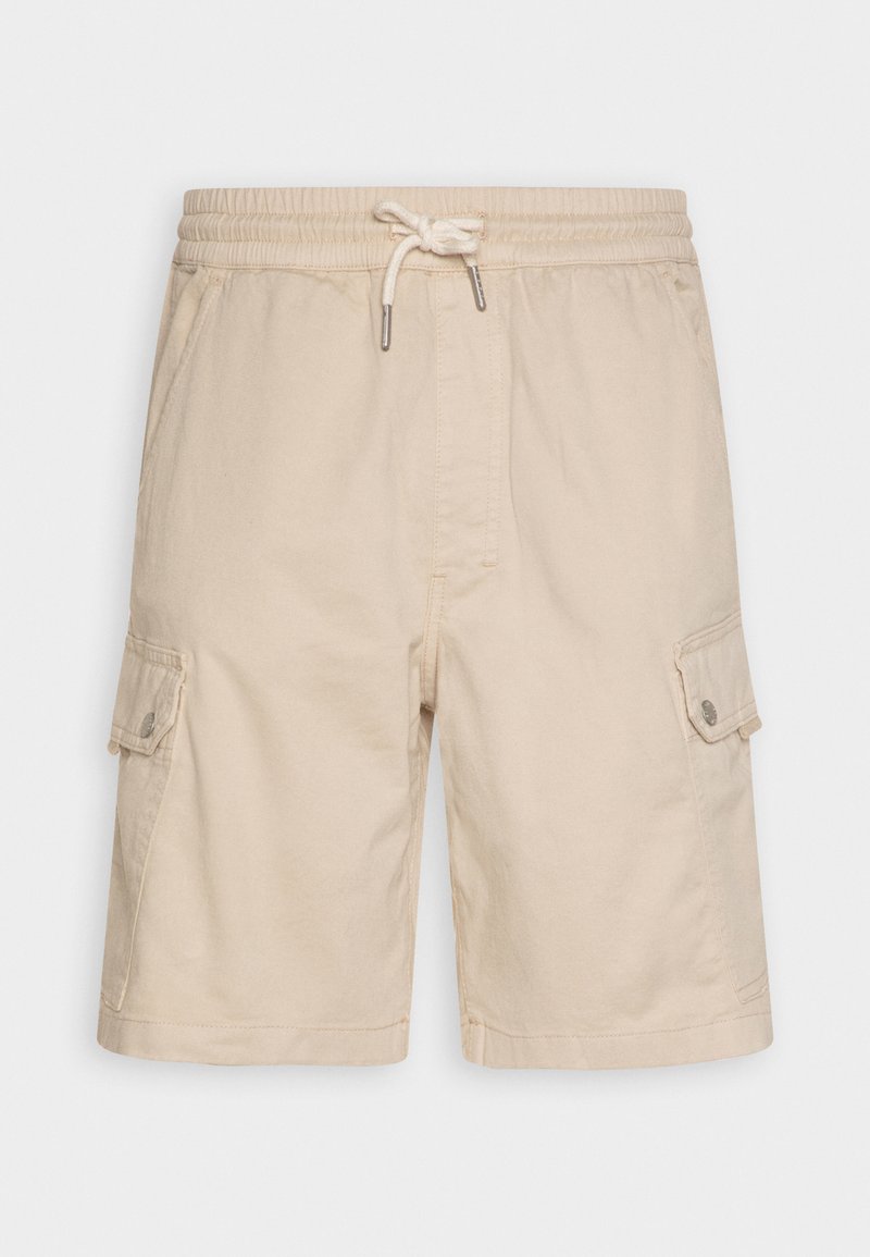 Shorts cargo en coton beige avec une taille élastique, cordon de serrage et deux poches latérales. Dispose de poches cargo latérales avec fermetures à bouton.