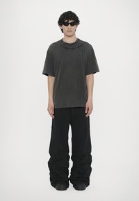 AVAVAV Tracksuit bottoms - black