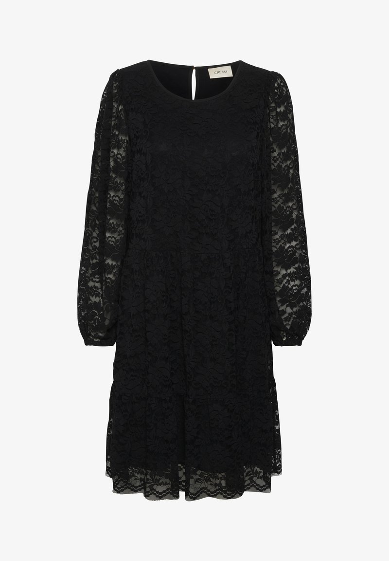 Robe en dentelle noire avec manches longues transparentes, encolure ronde et fermeture par bouton trou de serrure dans le dos.