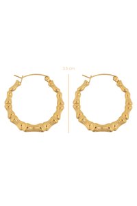 Boucles d'oreilles en or, diamètre de 3,5 cm, présentant un design inspiré du bambou avec des segments arrondis et une texture polie.
