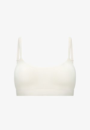 White seamless soft bra with thin adjustable shoulder straps and no visible closures or embellishments.