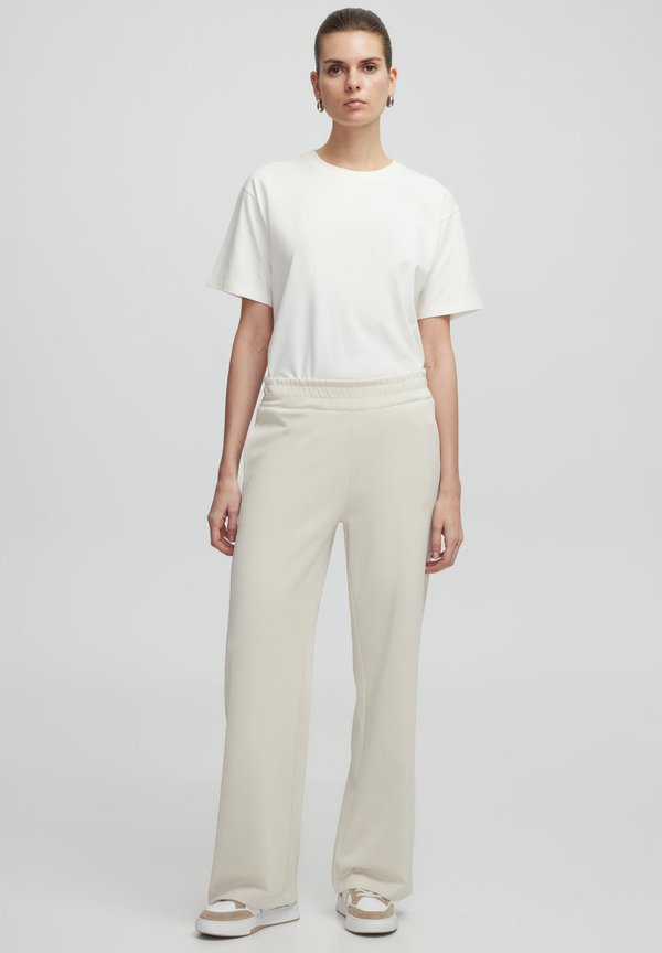 RELAXED FIT MONOGRAM PRINTED - Jogginghose - stone