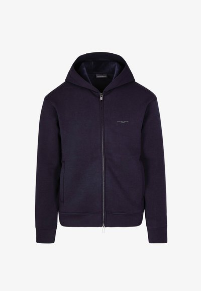 Hoodie zippé marine avec capuche à cordon, poches avant et poignets côtelés. Matière douce en mélange de coton avec un motif texturé subtil.