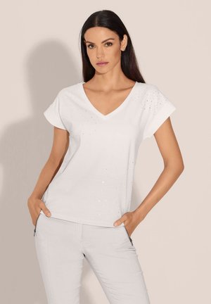 Witte V-hals t-shirt met korte mouwen, voorzien van verspreide versieringen. Zacht materiaal met een gladde textuur en een ontspannen pasvorm.