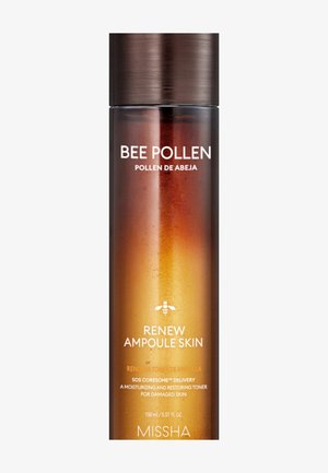 Flacon de lotion tonique pour la peau MISSHA Renew Ampoule avec extrait de pollen d'abeille, couleur dégradée ambre et bouchon marron foncé.