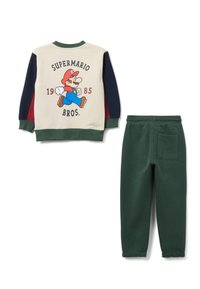 Completo per bambini in due pezzi composto da una felpa crema con grafica di Super Mario e pantaloni della tuta verdi con tasca posteriore. Tessuto in misto cotone.