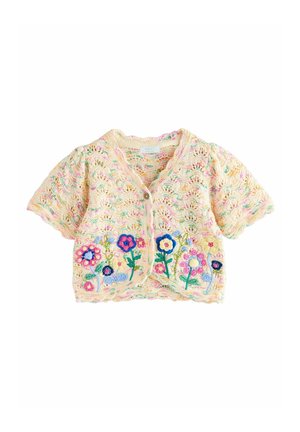 Cardigan pour bébé à manches courtes en crochet crème avec des fleurs brodées colorées sur le devant et une fermeture à boutons au niveau de l'encolure.