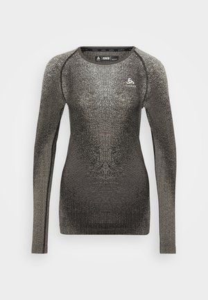 Long-sleeve athletic top in dark gray with textured knit design. Features a round neckline and a small logo on the chest.