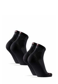 Calcetines deportivos negros con un diseño texturizado, que cuentan con un talón y una puntera reforzados, y un logo en el puño. Se exhiben tres pares.