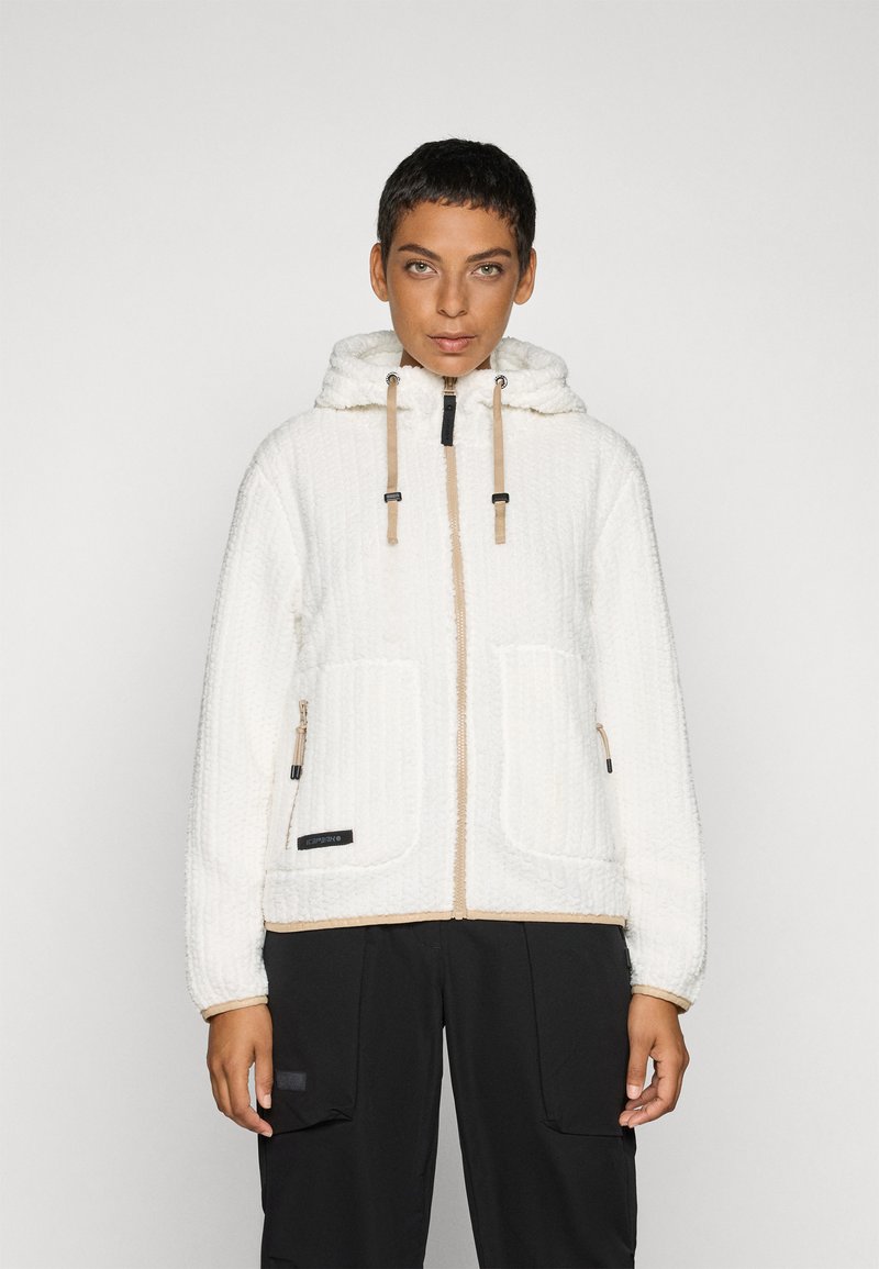 Veste en polaire blanche avec un design texturé, une capuche et des accents beiges. Comprend des poches avant et une fermeture éclair avec des tirettes.