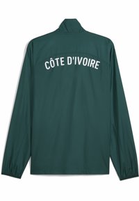Green lightweight jacket with long sleeves and a high collar. "CÔTE D'IVOIRE" is printed in white letters across the upper back.