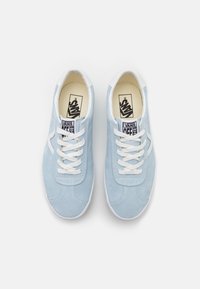 Light blue suede sneakers with white laces, round toe, and white rubber sole. Features Vans logo on tongue and distinctive side stripe.