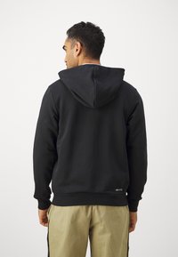 Nike Performance NBA CHICAGO BULLS FULL ZIP HOODY - Klubu apģērbs - black/pale ivory/red stardust