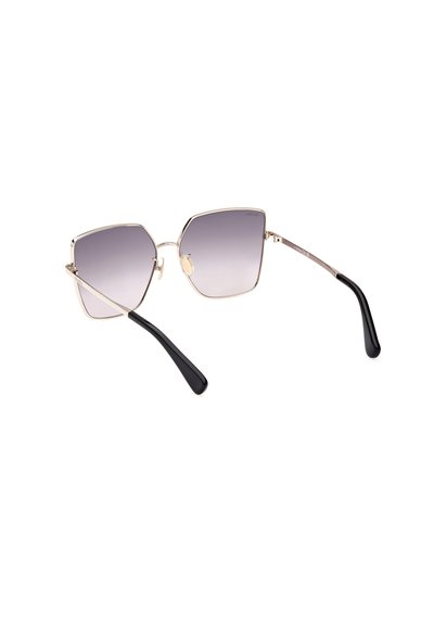 Hexagonální sluneční brýle s kovovým zlatým rámem a gradientními šedými skly. Černé acetátové nožičky s lesklým povrchem. Šířka skel: velká.