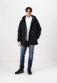 Tommy Hilfiger ROCKIE  - Piumino lungo - black