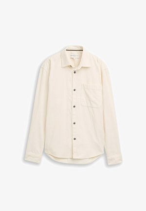 Crème-kleurige langemouwen shirt gemaakt van gestructureerde stof. Heeft een puntige kraag, sluiting met knopen aan de voorkant en een borstzak.