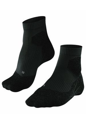 Calze nere alla caviglia con texture a costine, tallone e punta rinforzati, zone imbottite per il comfort e piccolo logo sul lato.