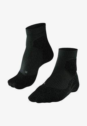 Calze nere alla caviglia con texture a costine, tallone e punta rinforzati, zone imbottite per il comfort e piccolo logo sul lato.