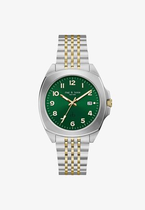 Zegarek z zieloną tarczą, złotymi i białymi znacznikami godzin, oknem daty na godzinie 3, złotą i srebrną bransoletą na ogniwach oraz srebrną kopertą z złotą koronką.