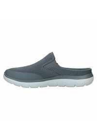 Gray slip-on shoes featuring breathable mesh material, a cushioned white sole, and a flexible design for easy wear.