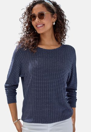 Navy blue long-sleeve top with a textured stripe pattern, round neckline, and relaxed fit. Features subtle silver accents throughout.