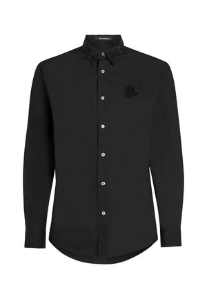 Black shirt with long sleeves, textured black beaded collar, front button closures, and a small embroidered logo on the chest.