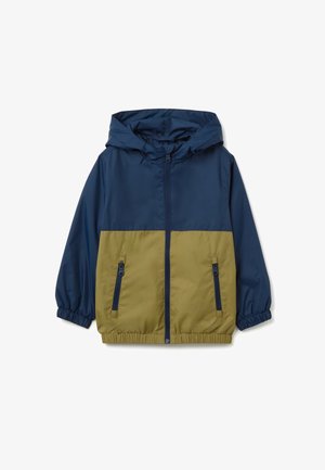 Veste à capuche avec une partie supérieure bleu marine et une partie inférieure vert olive, fabriquée en matériau léger. Comprend des poignets élastiques et des poches zippées.