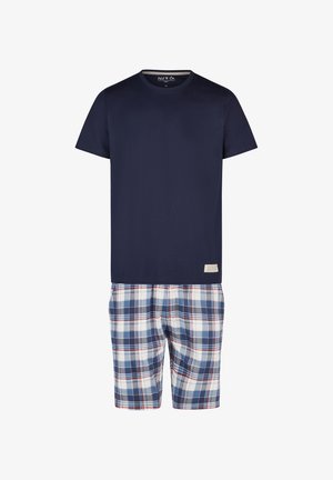 Ein navyblaues T-Shirt mit kurzen Ärmeln, kombiniert mit karierten Shorts in Weiß, Blau und Rot. Das Etikett ist am Taillenbund sichtbar. Aus Baumwolle gefertigt, im lässigen Schnitt.